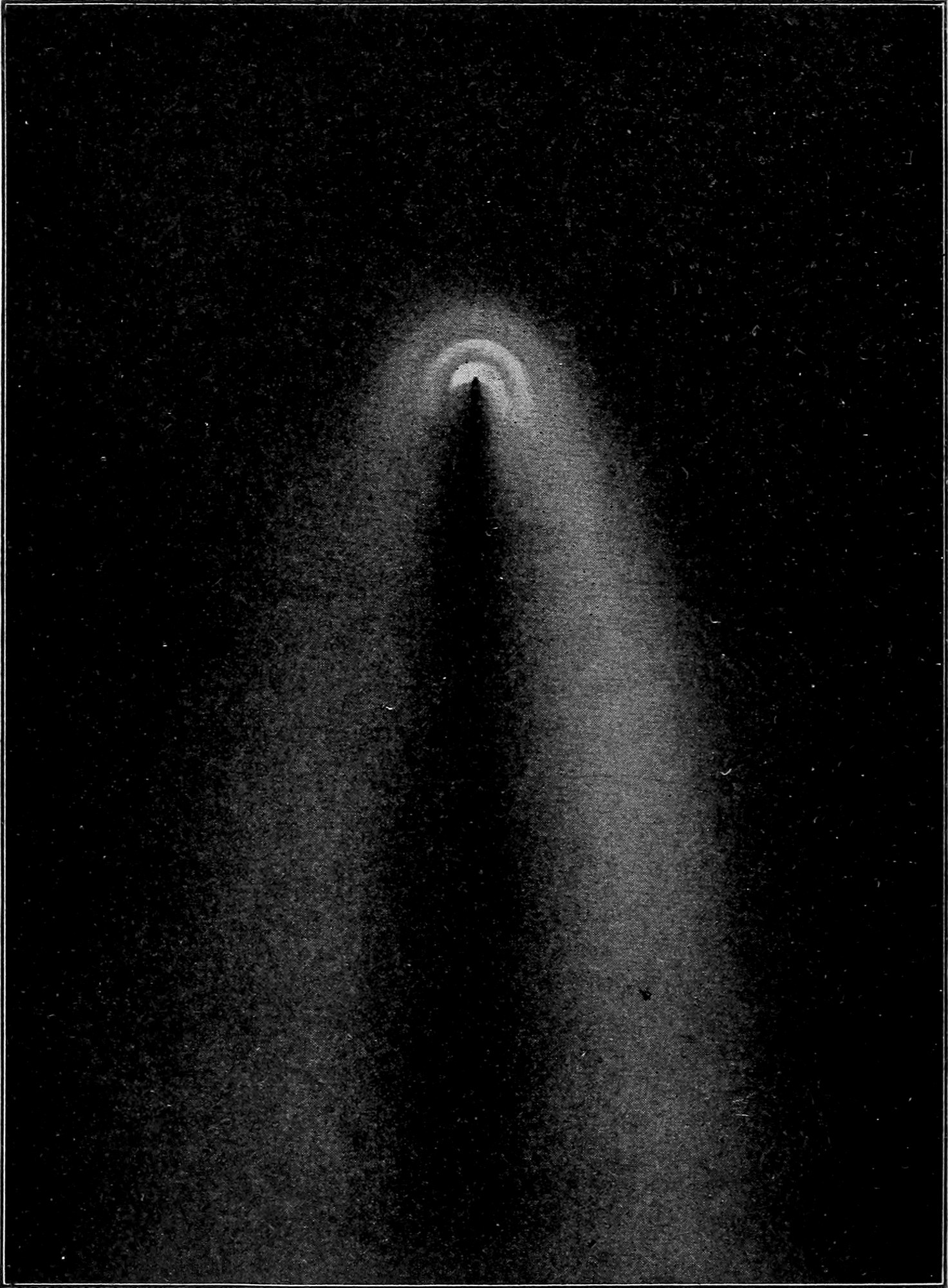 Fig. 47.—Head of Donati's Comet, drawn by G. P. Bond. — The comet's head as seen in the telescope: a bright nucleus inside nested arcs of light, with a dark channel running straight back from it between the two luminous sides of the tail.