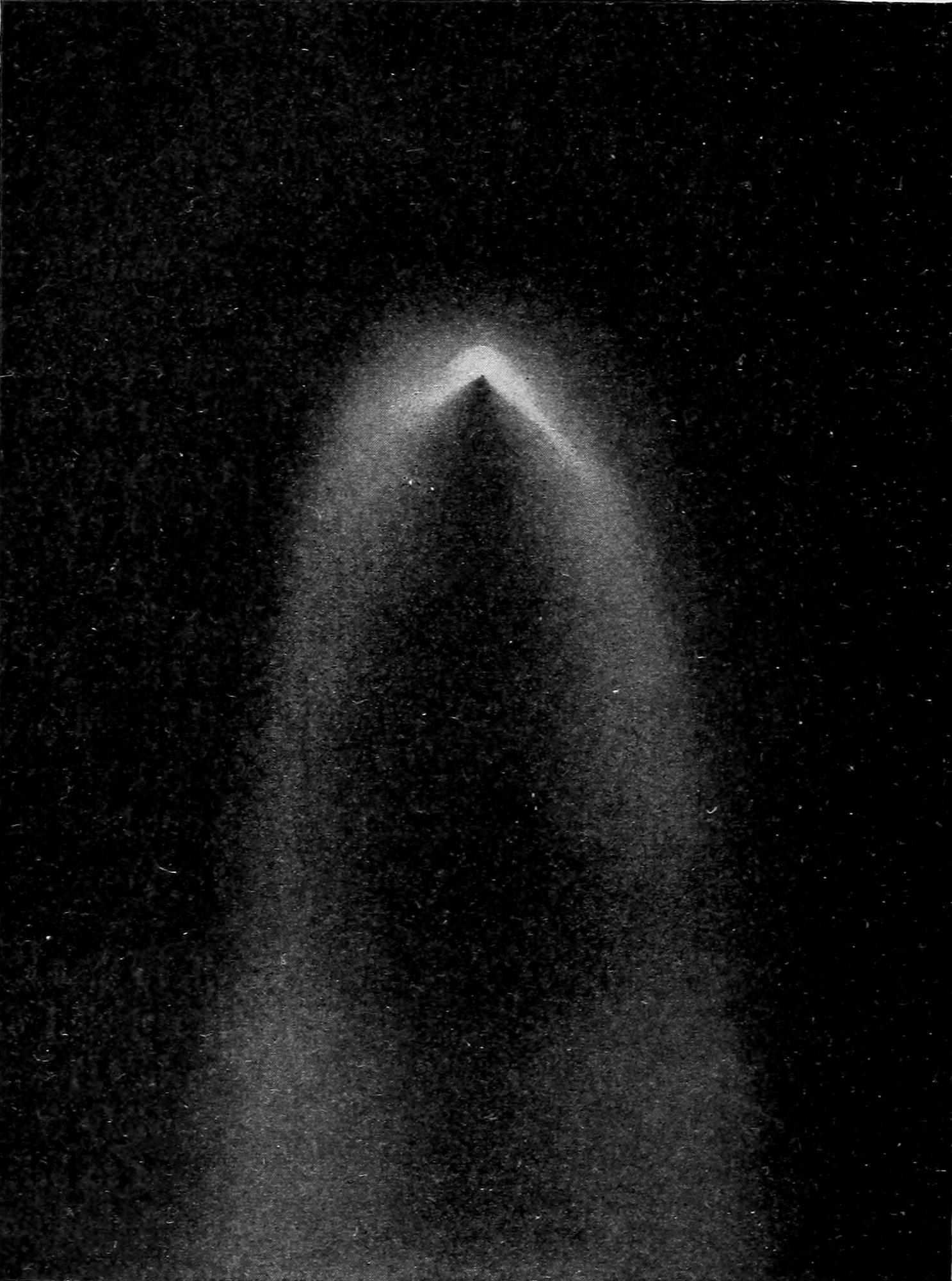 Fig. 48.—Great Comet of 1859, drawn by G. P. Bond. — A comet's head seen close, a bright arc bent sharply like an inverted V over a dark core, with broad pale streamers falling away below on either side.