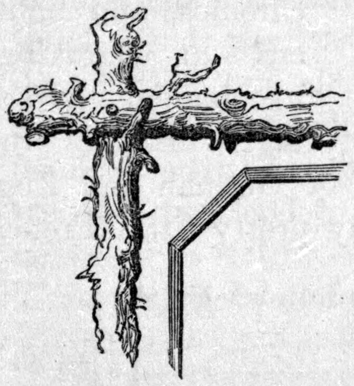 Fig. 40. — Corner of a rustic picture frame made from rough, knotted branches, with two gnarled limbs joined at right angles, shown beside a plain mitred wooden frame corner for comparison.