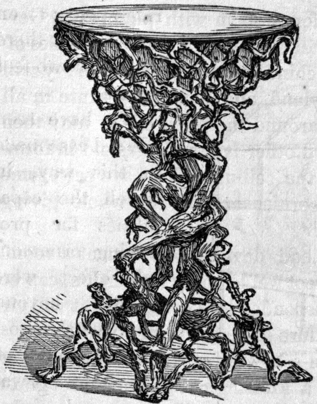 Fig. 46. — A stand for flowers made of twisted roots, scraped and varnished, with a spreading root base, a knotted twisting stem, and a round flat top.