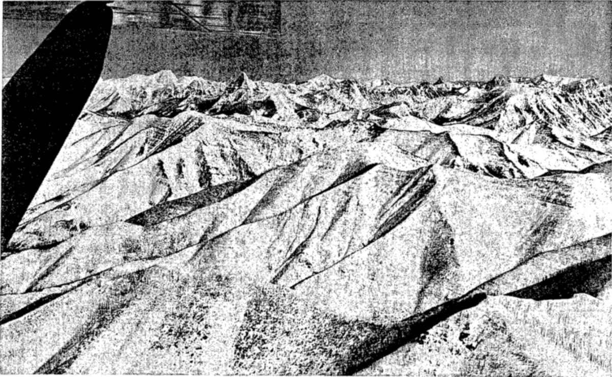 State and Federal agencies cooperate in winter inventories of the big game animals of the country, counting animals when they are concentrated on winter ranges. Airplanes are widely used for such inventories, permitting surveys of inaccessible mountain terrain, and making possible relatively accurate counts. Airplane counts are supplemented by men traveling on horseback, or on skis or snowshoes. Present estimates of the big game population of the United States total about 8¼ million animals. — An aerial view from a small airplane, with a propeller blade at left, looks across snow-covered ridges and valleys of rugged mountain country toward a distant skyline of peaks.