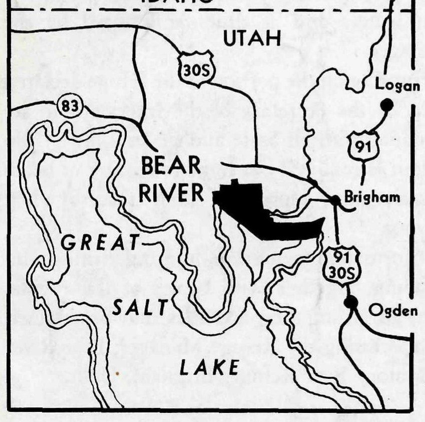 Locator map of northern Utah below the Idaho line. The refuge is a black shape at the north end of Great Salt Lake near Brigham, with Logan and Ogden marked and highways 83, 30S and 91 shown.