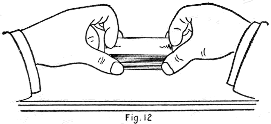 Fig. 12. — Forming the break in blind cut No. III, seen from the performer's side: the right-hand packet has come down on top, and the thumbs hold a narrow space between the two packets at one end.