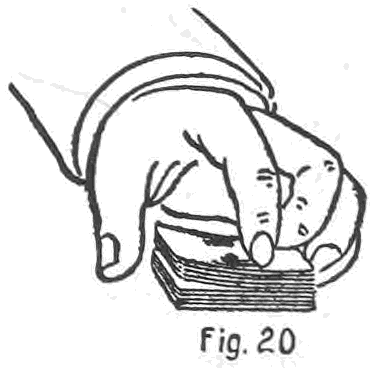 Fig. 20. — The ally cutting at the sides to a convex crimp: a finger tip presses on the top near the outside edge, tilting the upper packet so that the thumb finds the crimp.