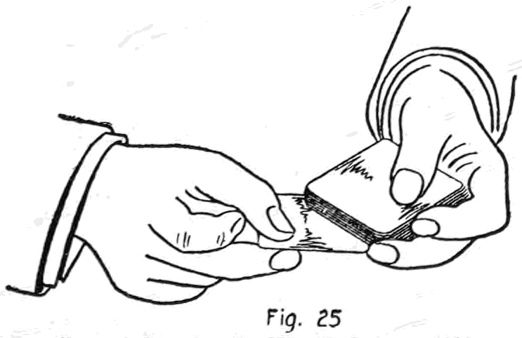 Fig. 25. — The bottom card being dealt: the right thumb and second finger draw it out from under the deck while the left thumb holds back the top card.
