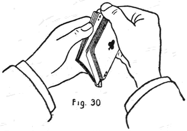Fig. 30. — Jogging a located card: the packet held by the right thumb and little finger is tilted outward past the corner of the packet in the left hand, opening the deck at the desired card, a club.