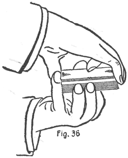 Fig. 36. — Top palm, first method: the right hand covers the deck held in the left, its little finger pulling the top cards up about half an inch at the corner, clear of the left fingers.