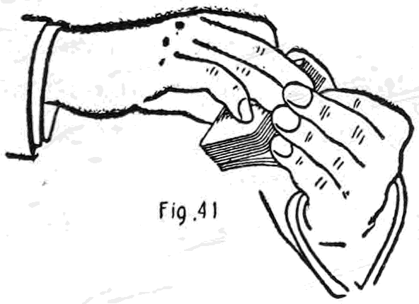 Fig. 41. — Bottom palm, second method: the right hand holds the deck by the ends, first finger curled on top, while the left little finger at its first joint grips the corner of the under cards.