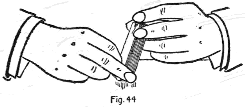 Fig. 44. — After a riffle the deck is raised on its end on the table, held at the sides between the second finger and thumb of each hand, and tapped to square it.