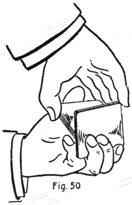 Fig. 50. — The left fingers draw off the upper packet under cover of the right hand, which holds the lower packet against the left thumb, until it just clears the lower packet's side.