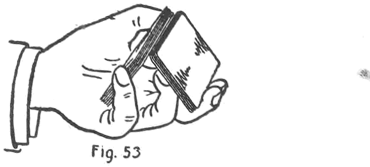 Fig. 53. — The under packet is drawn out by the left second and third fingers and tilted up until its inner side just clears the outside of the upper packet, held by the thumb.