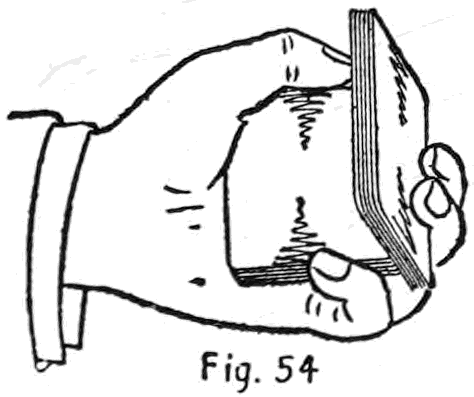Fig. 54. — The under packet, now on edge, is carried up and over on top, the left little finger pulling down on the upper packet beneath it.
