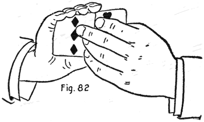 Fig. 82. — The Palm Change: the left thumb and fingers seize the two cards held as one, a diamond card in front, drawing one off as the other is pressed up into the right palm.