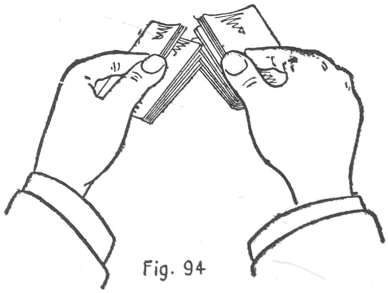 Fig. 94. — The Second Method: the two packets meet at a sharp angle, one in each hand, and both thumbs spring their inner corners into each other, the right hand's top cards still free.