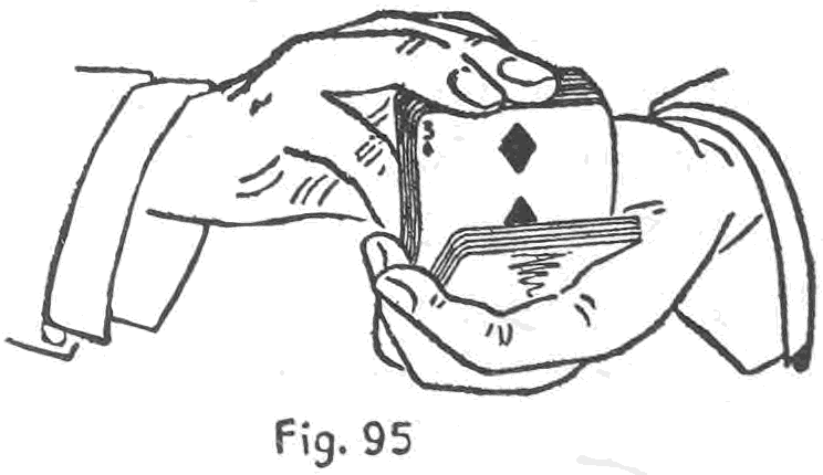 Fig. 95. — Determining a card thought of: the right hand springs the outer ends of the deck toward the spectator and pauses so that one card, the three of diamonds, shows more fully than the rest.