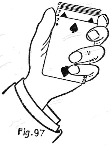 Fig. 97. — The Slide: the left hand holds the deck face up, and the third and little fingertips have slid the bottom card, the two of spades, toward the wrist, exposing the seven above it.