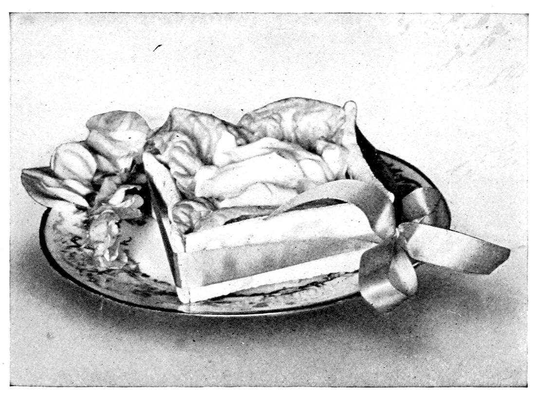 Berkshire Salad in Boxes. — Salted crackers stand on edge to make a small open box, tied at one corner with a ribbon bow and garnished with holly at the other, lined with lettuce and filled with salad.
