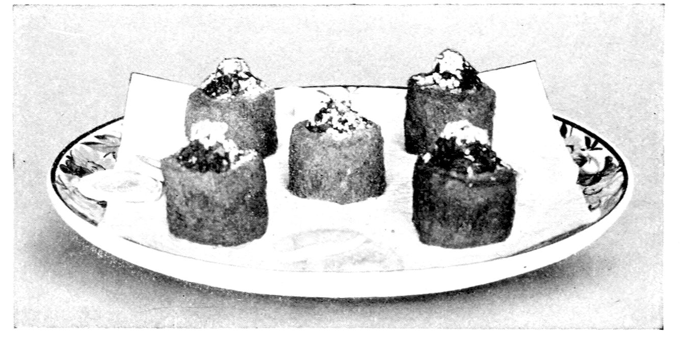 Dresden Patties. — Five round, deep-fried bread cases, browned and hollowed, stand on a folded napkin on a patterned plate, each filled and heaped at the top.