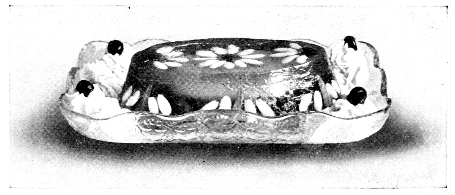 Royal Diplomatic Pudding. — A clear jelly mould, its top set with a large daisy of white petals and its sides with a row of the same pieces, whipped cream heaped at the corners and topped with cherries.