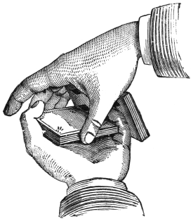 Fig. 3. — The pass in progress: the left fingers draw the upper packet away while the right hand lifts the outer edge of the lower packet, so that the edges of the two packets just clear each other.