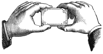 Fig. 35. — The two hands grasp the pack between finger and thumb at each end, ready to draw apart.