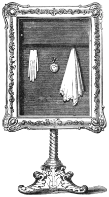 Fig. 292. — The Magic Picture Frame on its twisted stand, with a lady’s glove, a watch and a handkerchief hanging against the black background, and the black blind flying up out of sight at the top.