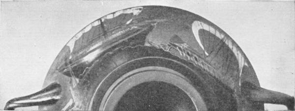 Fine Piece of Athenian Pottery. Showing Greek merchant vessels with sails and oars. Brit. Mus. — The painted rim of a shallow two-handled cup seen from above, with a dark sailing ship drawn around its curved edge.