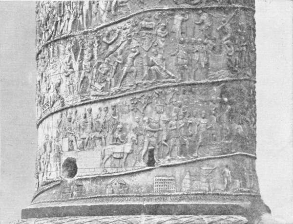 The Column of Trajan at Rome. Representing his conquests at Dacia and elsewhere — The lower drums of the column, carved in spiral bands of relief with crowds of Roman soldiers, horses, carts and buildings, winding upward around the shaft.