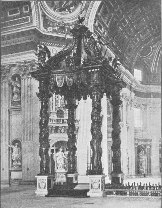 Interior of St. Peter’s, Rome, Showing the High Altar. Photo: Alinari — The great bronze canopy over the high altar stands on four twisted columns beneath the domed and coffered ceiling, with statues in niches in the piers around it.
