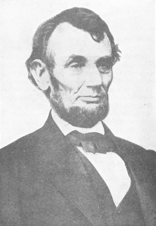 Abraham Lincoln — A photographic portrait of Lincoln, head and shoulders, bearded and without a moustache, in a dark coat and bow tie.