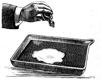 A shallow layer of blue-coloured water in a white dish, with a few drops of alcohol poured into the middle. The water has won the tug-of-war and swept outwards, leaving the centre of the dish bare.