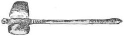 Hatchet of the Stone Age — A hatchet of the Stone Age: a heavy, rounded stone head bound across the end of a long wooden handle.