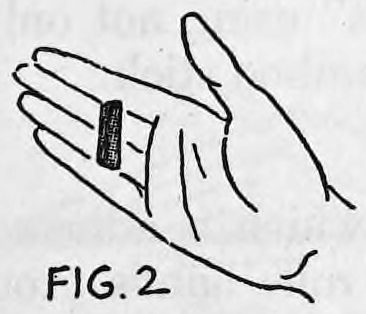 Fig. 2. — An open right hand seen from the front with the small metal clip hidden between the second and third fingers, its pin between the fingers.
