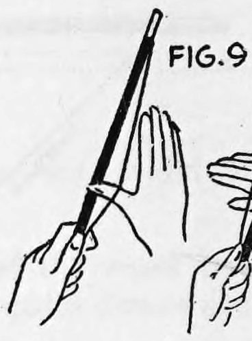 Fig. 9. — The wand slanting upward, held at its lower end by the left hand while the right thumb draws back under the loop of thread.