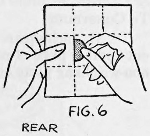 Fig. 6. — Rear view of the paper held in the left hand, while the right hand slips the half dollar into the pocket behind the paper.