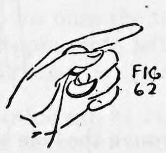 Fig. 62. — The left hand with second, third and fourth fingers curled inward, holding the coin in the Curled Finger Tip Palm position.