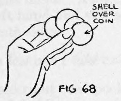Fig. 68. — The left hand with coins spread over the fingers and thumb on top, the coin with the shell over it marked at the top.