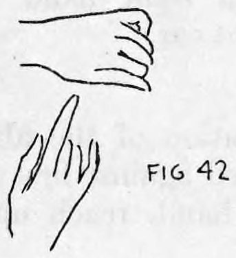 Fig. 42. — Hands as the audience sees them: the left hand closed as if holding the cigarette and the right index finger pointing at it.