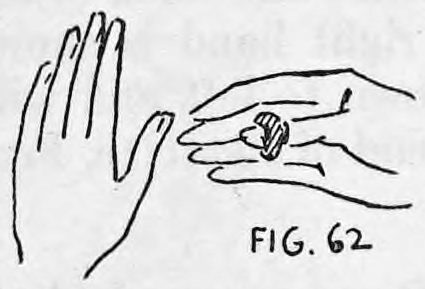 Fig. 62. — Hands brought together, left palm to the audience and back of the right hand to the audience, the Thumb Tip on the right thumb.