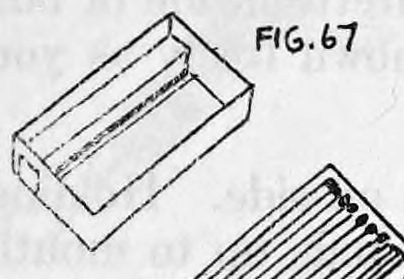 Fig. 67. — An open match-box drawer seen from above, with a cardboard partition walling off a long narrow space along one side to hold a cigarette.