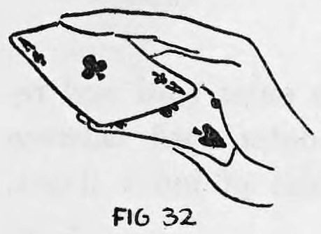 Fig. 32. — The corner of a card is gripped between first and second fingers and pulled to a horizontal position, with the thumb beneath it.