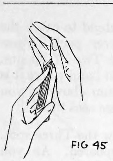 Fig. 45. — The right hand passes over the deck, the thumb above and fingers behind it, at the position where the rear card is pushed forward into the hand.