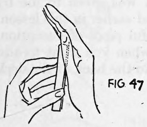 Fig. 47. — The left hand pushes the card into the right hand, where only the two upper corners are gripped between the right fingers.