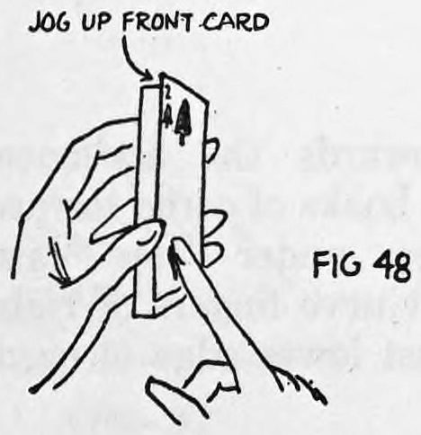 Fig. 48. — The right forefinger pushes the card up about a quarter inch, leaving a jog at the top; a label points to the jogged front card.