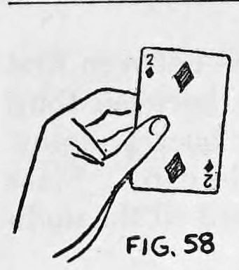 Fig. 58. — The left hand holds the deck up with the face card, a Two of Diamonds, exposed to the audience.