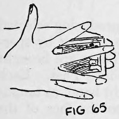 Fig. 65. — The right hand held over the deck with its fingers spread wide open, so the card can be seen through the gaps.