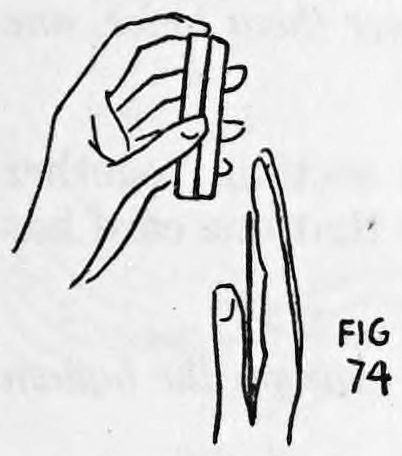 Fig. 74. — The right hand draws away from the deck, bringing the rear card with it gripped in the crotch of the thumb.
