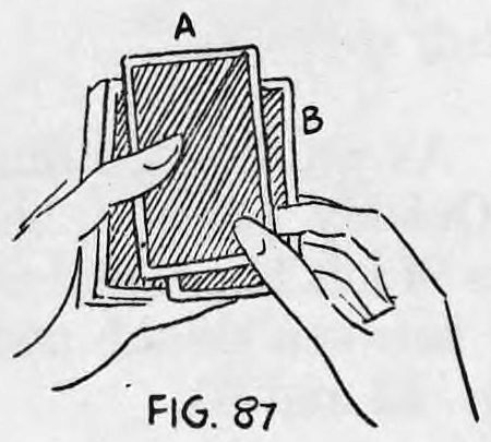Fig. 87. — Card A brought down to the deck, card B gripped between first and second fingers of the right hand and the left thumb over A.