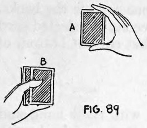 Fig. 89. — Card A held up in the right hand, thumb at the bottom and two fingers at the top, with card B pushed over to the right on the deck in the left hand.