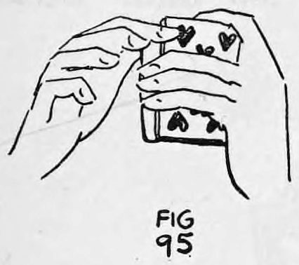 Fig. 95. — View from underneath showing the finger positions of the right hand on the deck held in the left hand, with a card face visible.